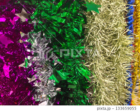 Colorful metallic decorations shining together in vibrant hues Colorful metallic decorations shining together in vibrant hues 133659055