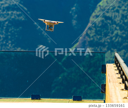 Drone flying against norwegian nature Drone flying against norwegian nature 133659161