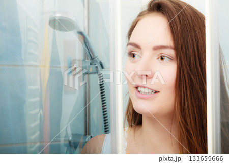 Woman showering in shower cabin cubicle. Woman showering in shower cabin cubicle. 133659666