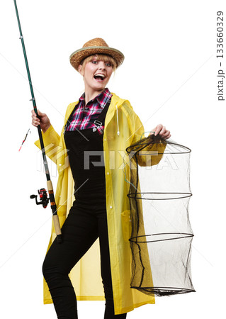 Happy woman holding fishing rod and keepnet 133660329