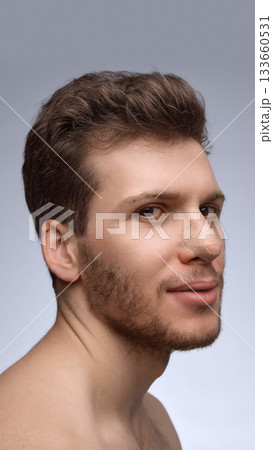 Man smiling slightly with nose bandage during early recovery Man smiling slightly with nose bandage during early recovery 133660531