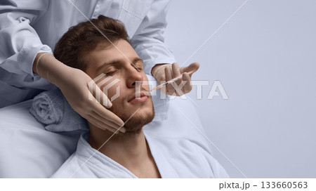 Lip contour correction injection enhancing male facial harmony. 133660563