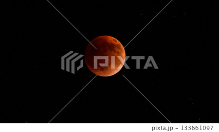 Blood moon during a lunar eclipse in the night sky. The moon appears red as it is shadowed by the Earth Blood moon during a lunar eclipse in the night sky. The moon appears red as it is shadowed by the Earth 133661097