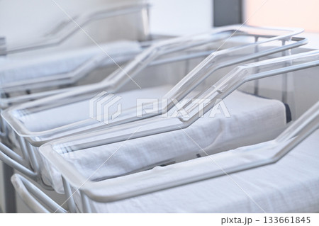 Newborn nursery beds ready for infants in a modern healthcare facility Newborn nursery beds ready for infants in a modern healthcare facility 133661845
