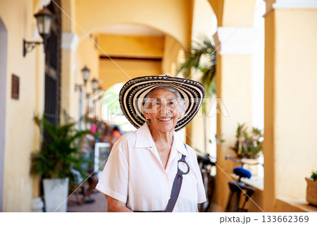 Senior travel. Senior woman at the beautiful heritage town of Mompox wearing the traditional Sombrero vueltiao. 133662369