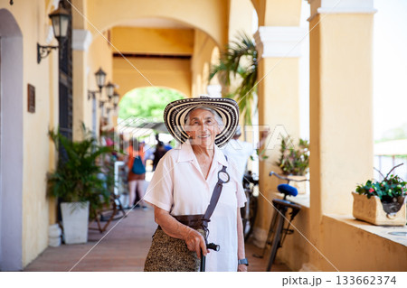 Senior travel. Senior woman at the beautiful heritage town of Mompox wearing the traditional Sombrero vueltiao. 133662374