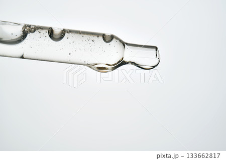 Cosmetic pipette dispensing serum for skin care treatment Cosmetic pipette dispensing serum for skin care treatment 133662817