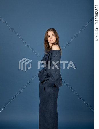 Beautiful woman with blue linen suit studio portrait 133662831