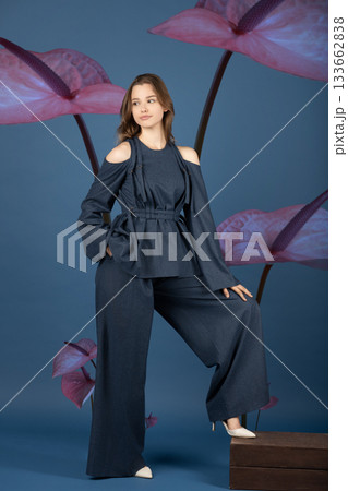 Beautiful woman with dark linen suit studio portrait in Anthurium flowers background 133662838