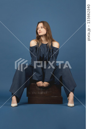 Beautiful woman with blue linen suit studio portrait 133662840