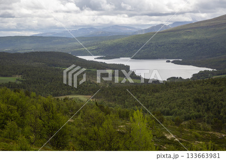 Exploring the scenic beauty of Lake Flatningen from Strondsaeterhoe mountain in Norway's Vang Municipality Exploring the scenic beauty of Lake Flatningen from Strondsaeterhoe mountain in Norway's Vang Municipality 133663981
