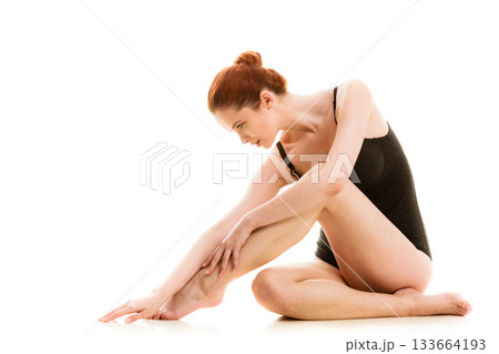 Sitting woman in underwear showing smooth legs Sitting woman in underwear showing smooth legs 133664193