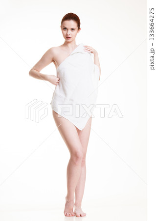 Naked woman in towel after bath 133664275