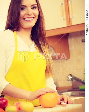 Gorgeous cook preparing dish. Gorgeous cook preparing dish. 133664586