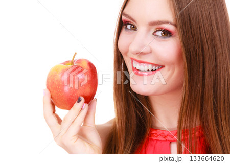 Woman charming girl colorful makeup holds apple fruit Woman charming girl colorful makeup holds apple fruit 133664620
