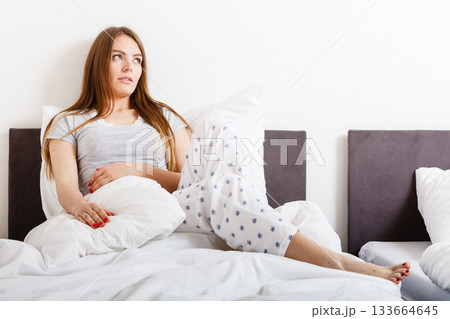 Lady in bed. 133664645