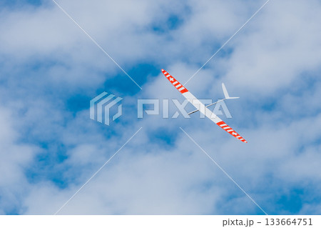 RC soaring plane on blue sky RC soaring plane on blue sky 133664751