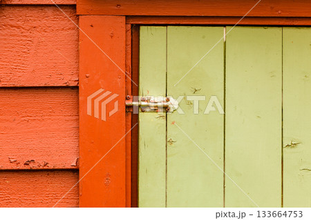 Big green oldfashioned wooden doors in house 133664753