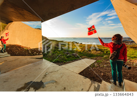 Andoya island sea coast and tourist with norwegian flag Andoya island sea coast and tourist with norwegian flag 133664843
