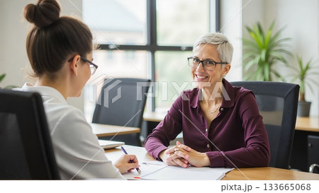 A student sits with the principal, discussing academic performance, future goals, and potential pathways to success 133665068