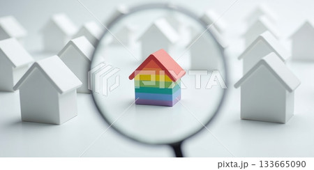 House with magnifier among white homes for property search - ai generated 133665090
