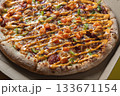 Close-Up of Freshly Baked Pizza with Colorful Toppings 133671154