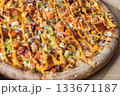 Close-Up of Freshly Baked Pizza with Colorful Toppings 133671187