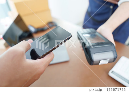 Digital Payment. Customer using smartphone for contactless payment. Digital Payment. Customer using smartphone for contactless payment. 133671733