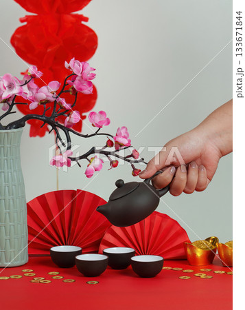 Chinese New Year tea service with flowers and red decorations 133671844
