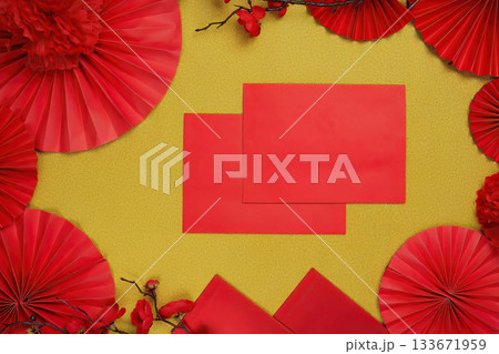 Chinese New Year background with red envelopes and decorations, top view 133671959