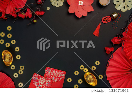 Top view of Chinese New Year decorations with tea and gold coins Top view of Chinese New Year decorations with tea and gold coins 133671961