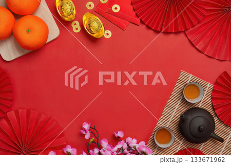 Chinese New Year background with oranges and tea set, top view 133671962