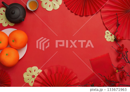 Top view of Chinese New Year decorations with oranges and tea Top view of Chinese New Year decorations with oranges and tea 133671963