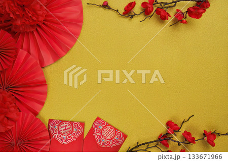 Chinese New Year festive background with red envelopes and floral accents 133671966
