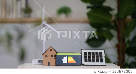 Sustainable Energy Solutions. Display of wind turbine and solar panel models. Sustainable Energy Solutions. Display of wind turbine and solar panel models. 133672003