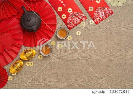 Elegant Chinese New Year setting with tea and gold ingots Elegant Chinese New Year setting with tea and gold ingots 133672012