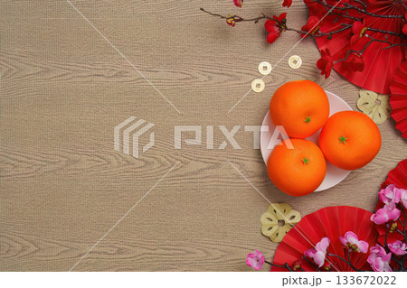 Chinese New Year festive background with oranges and decorations Chinese New Year festive background with oranges and decorations 133672022