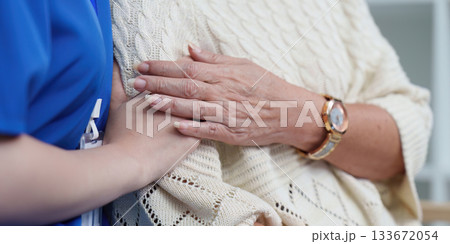Healthcare. Compassionate nurse providing emotional support to elderly patient. 133672054