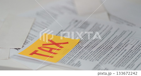 Tax documentation. Close-up of tax forms with a focus on important details. Tax documentation. Close-up of tax forms with a focus on important details. 133672242