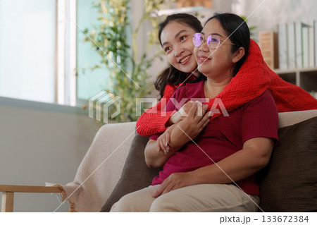 Emotional connection. Young woman embracing her mother, showcasing love and support. 133672384