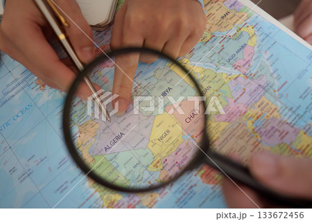 Travel Planning. Close-up of hands pointing at a map. 133672456