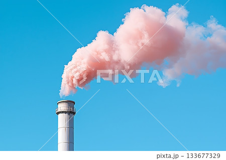 Factory chimney emitting pink smoke against a clear blue sky creating environmental concerns 133677329