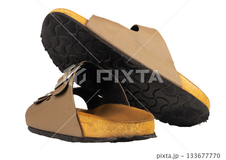 Brown leather sandals on white background 133677770