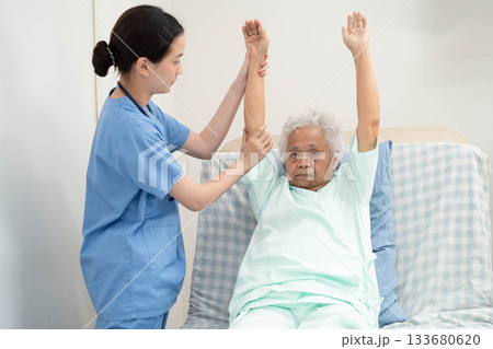 Asian doctor checking and treat elderly woman patient health in hospital. Asian doctor checking and treat elderly woman patient health in hospital. 133680620