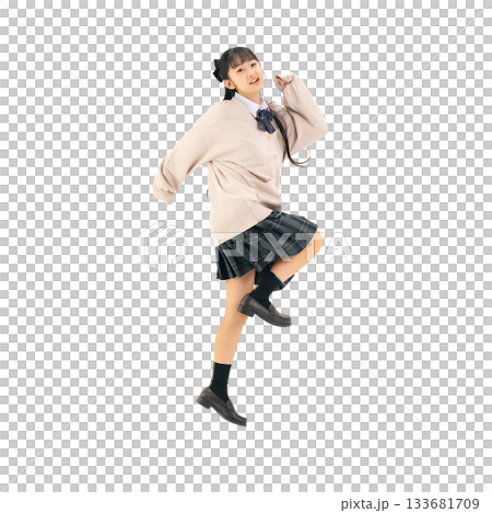 A female student in a uniform jumping energetically. A transparent, hand-cut, full-body PNG photo. 133681709