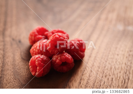 ripe raspberry on a walnut wood background with copy space ripe raspberry on a walnut wood background with copy space 133682865