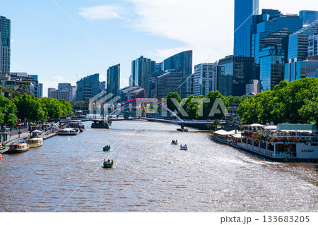 A bridge with Merry Christmas sign over the Yarra River in the business center of Melbourne, Australia. 133683205