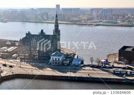 Royal Depot building and Scheldt river, Antwerp cityscape featuring historic architecture and urban waterfront views 133684600
