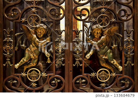 Rome, Italy. Interior of St. Peters Basilica. Carved doors with angels Rome, Italy. Interior of St. Peters Basilica. Carved doors with angels 133684679
