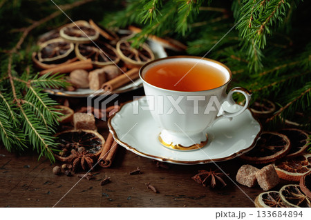 Christmas tea with spices and dried citrus slices. Christmas tea with spices and dried citrus slices. 133684894